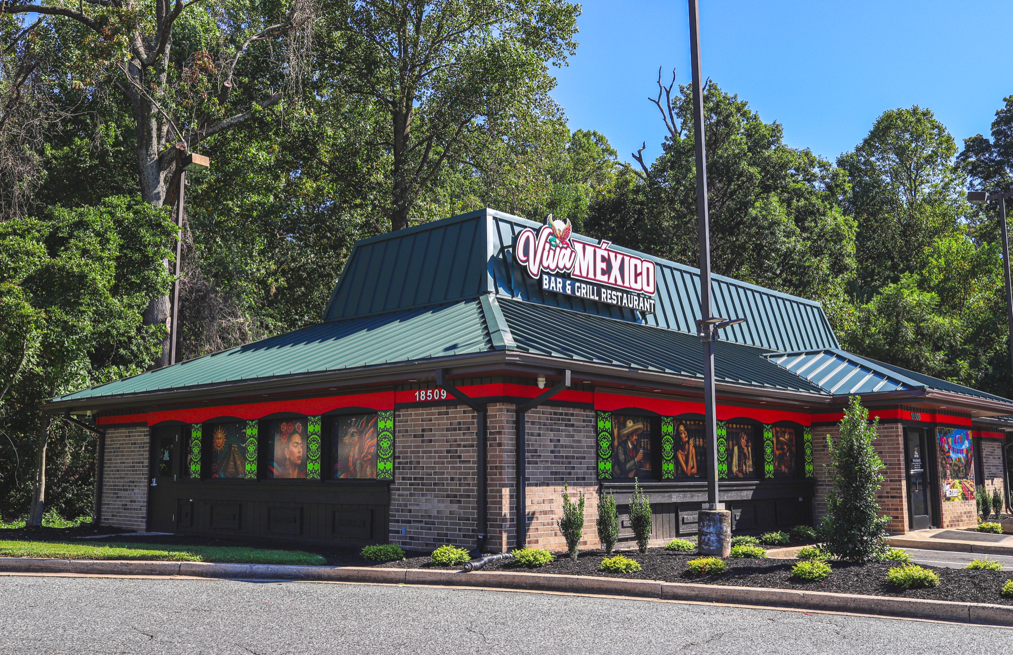 Angled view of the Viva Mexico Bar & Grill storefront and restaurant sign